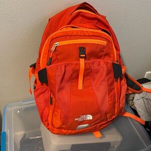 Bright orange north face backpack